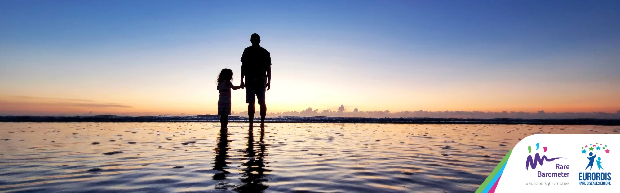 A man with his child by the water